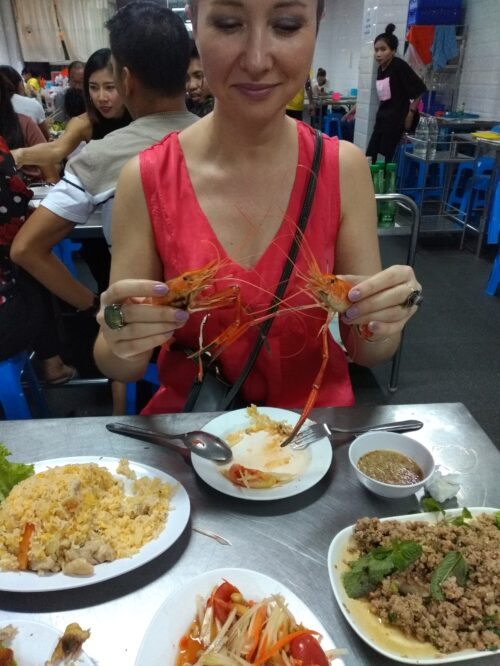 Katia playing with her food in Bangkok