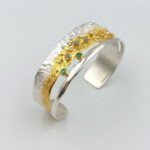 mixed metal-diamond-emerald-bracelet